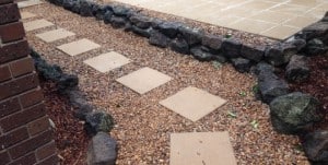 Concrete square tiles pebbles rocks landscaping