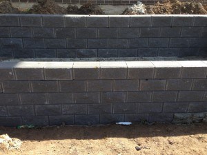 brick wall grey landscaping